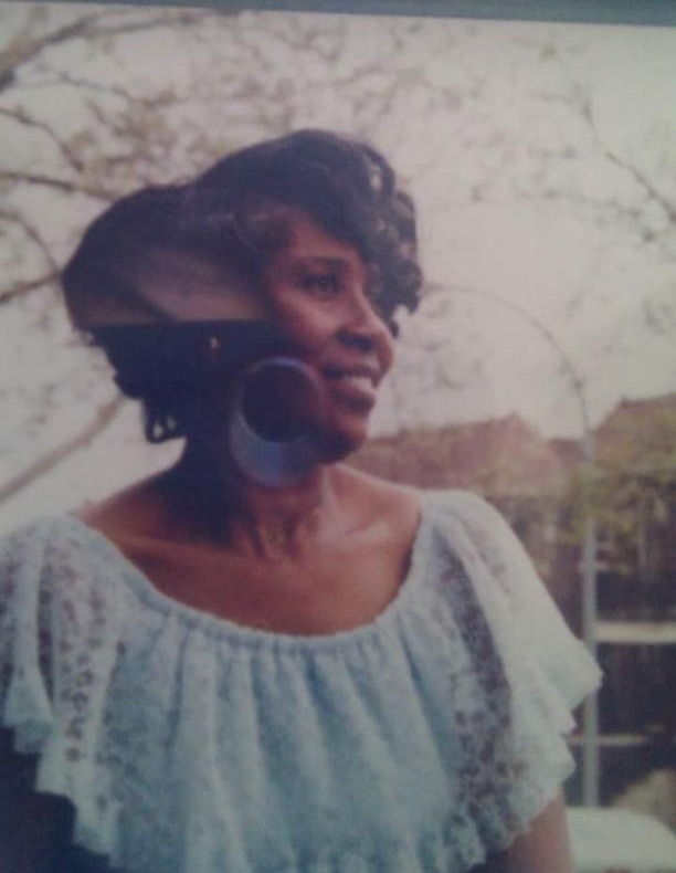 Premmie Lee Stephenson smiling in a blue lace top